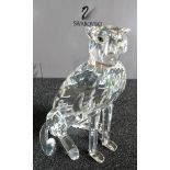 A boxed Swarovski seated leopard, without damage or repair