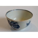 An 18th Century blue and white Worcester tea bowl of Chinese form, small blue crescent mark to base,