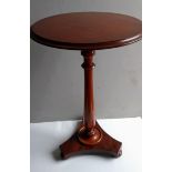 A late Georgian circular mahogany occasional table on a baluster column and platform base, 75 x 50cm