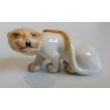 A Royal Worcester blush ivory netsuke, modelled as a cheetah, 1913, 4.5cm H, printed mark, without