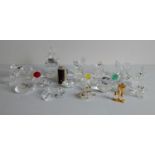 An assortment of Swarovski Crystal figurines of birds, animals, flowers, etc, approximately 20 in