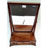 A Georgian mahogany vanity mirror on crutch supports with three drawers under,