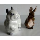 A Royal Copenhagen white rabbit figurine, numbered 22690 and another rabbit figurine, numbered 1019,