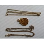 A yellow gold medal, pendant on chain and one other chain, all hallmarked 9ct, 14g (3)