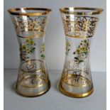 A pair of early 20th century Moser-style vases of waisted form with gilt rims and isometric