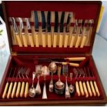 A complete (64-piece) silver plated canteen of cutlery with bone handles by Atkinson Bros.,