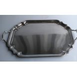 A George V silver two-handled butler's tray with pie-crust decoration by Goldsmiths & Silversmiths