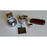 A cased 9ct rose gold-tipped cheroot holder, hallmarked; three silver napkin rings, mixed dates,