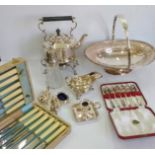 An assortment of silver plated items to include a tea kettle-on-stand, swing handle basket, etc