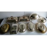 An assortment of silver plated entree dishes, food warmer, etc