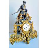 A French 19th century gilt and slate mantle clock with elaborately carved applied figure of knight