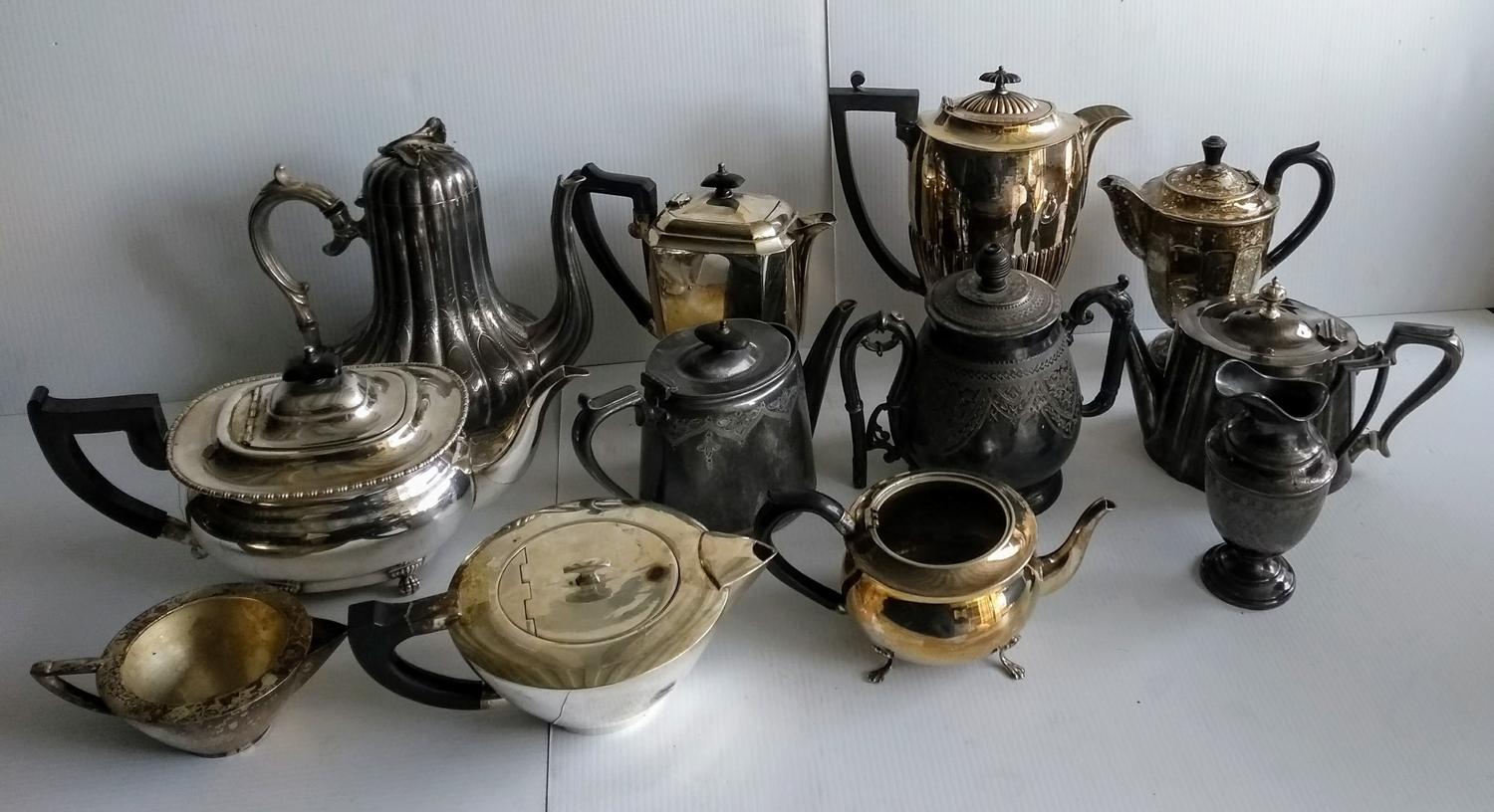 A quantity of silver plated tea pots, water jugs, coffee pots, etc