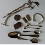 A silver Albert chain with t-bars, a torc bangle, a 5-franc pendant dated 1875, two others ingot