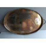 An oval silver plated two-handled butler's tray with pierced gallery decoration, 71 x 43 cm