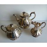 A Victorian silver three-piece tea set comprising teapot, two-handled sugar basin with lid and