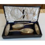 A George V five-piece cased silver brush set (no hand mirror) with engine turned design, Birmingham,