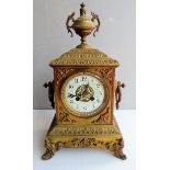 A 19th century brass-cast French mantel clock with architectural features, mechanism by Japy Freres,