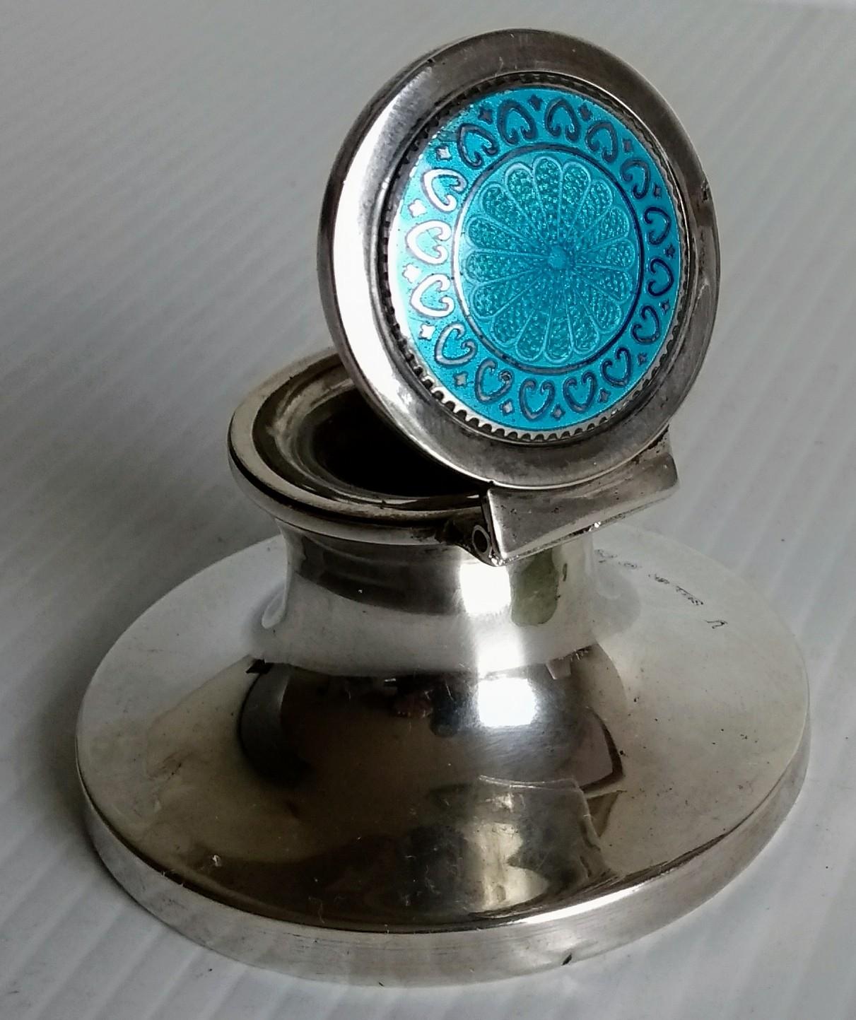 An Edwardian silver capstan with guilloche enamel decoration to lid, glass liner (tiny nibble) by