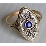 An Art Deco-style sapphire and diamond ring with rose-cut diamond decoration surrounding a