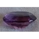 An 11.04 carat oval-cut natural amethyst gemstone, 19mm x 13mm x 9mm approximately