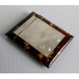 An Edwardian tortoiseshell and mother-of-pearl card case, with hinged cover, 10 x 7.5 cm