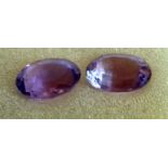 A near pair of natural oval-cut amethysts: 12.03 carat 19mm x 13mm x 9mm; 12.69 carat 19mm x 14mm