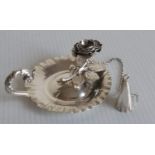 A George IV silver chamber stick in the form of an applied rose with conforming snuffer by Charles