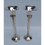 A pair of George V silver trumpet-shape stem vases with wavy rims and circular stepped bases by