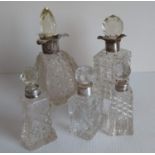 Two Victorian large silver-collared cut-glass scent bottles, one by Mappin Brothers, 1900, 19, 17 cm