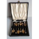 A George V cased set of six silver coffee spoons with scallop shell decoration by Cooper