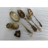 A Victorian silver sports medal and four miscellaneous spoons, mixed dates, 104g