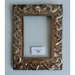 An early 20th century Chinese export silver photo frame with pierced and embossed dragon