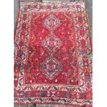 A hand-knotted Baluch wool rug with double border, short fringe, in good condition, light wear,
