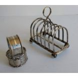 An Edwardian silver toast rack on ball feet by Goldsmith & Silversmiths, London, 1910, 11 x 12 cm