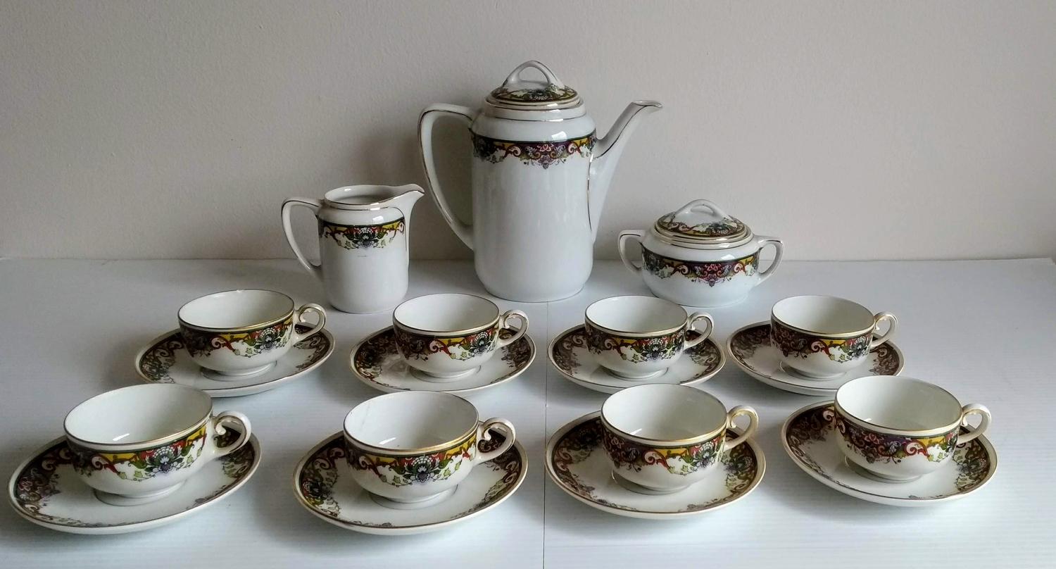 An early 20th century KPM Germany coffee service comprising 8-cups/saucers, coffee pot, lidded