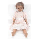 A German bisque headed Indian style doll by Simon & Halbig With dark brown hair,