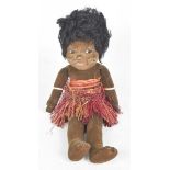 A Nora Wellings 1930's South Sea Island doll With black wig, fixed brown eyes, wearing grass skirt,