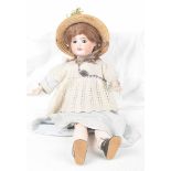 A French bisque headed doll With auburn wig, open / shut brown eyes, open mouth,