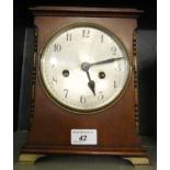 An early 20th Century mahogany cased mantel clock, with brass movement, striking on a gong.