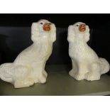 A pair of 19th Century Staffordshire model spaniels