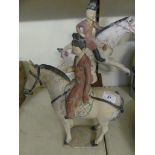Two 20th Century Chinese pottery models of tang type horses and riders, one with wooden plinth.