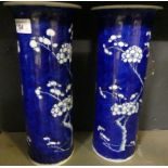 A pair of 19th Century Chinese blue and white cylinder vases decorated with prunus flowers.