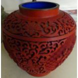 A 20th Century Chinese cinnabar lacquer squat vase, decorated with floral detail.