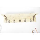 A vintage style coat rack and shelf