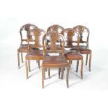 A set of six 19th Century walnut dining