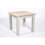 A small rustic pine kitchen table