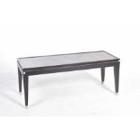 A rectangular ebonised coffee table