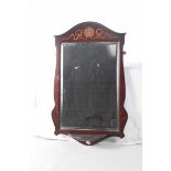 An Edwardian inlaid mahogany wall mirror