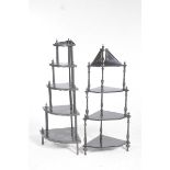 Two Edwardian ebonised whatnots The first with five graduated shelves adorned with decorative