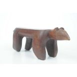 A zoomorphic carved wooden stool,